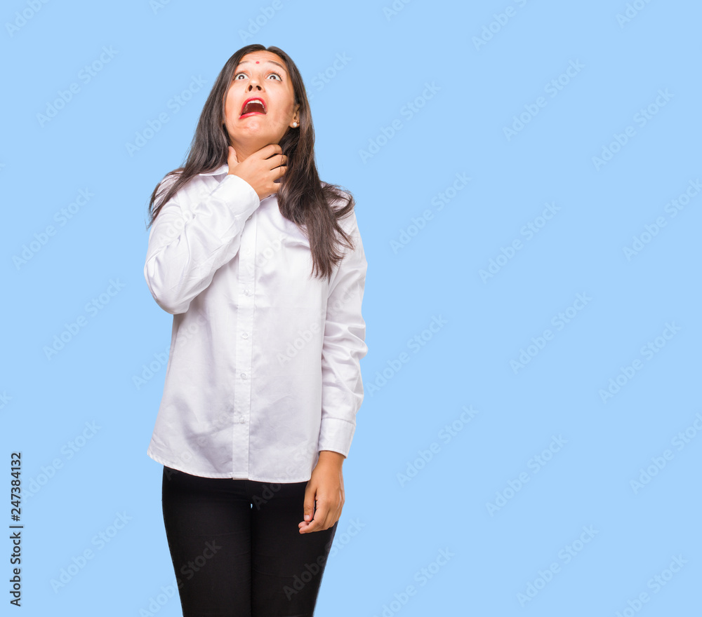 Portrait of a young indian woman worried and overwhelmed, anxious feeling pressure, concept of anguish