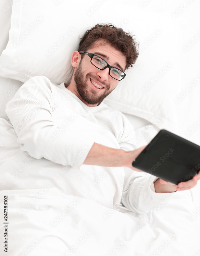 background image . man reading on digital tablet. background image . man reading on digital tablet.