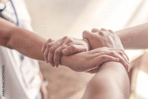 People hand assemble as a connection meeting teamwork concept. Group of people assembly hands as a business or work achievement. Man and women touch each other hands outdoor. Confident teamwork.