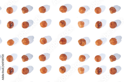 hazelnut layout on a white background, purified kernel of the nut removed from the top
