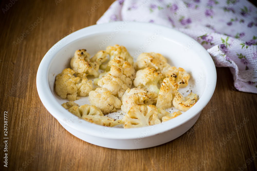 baked cauliflower with spices in ceramic form