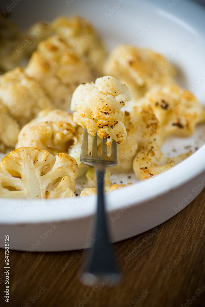baked cauliflower with spices in ceramic form baked cauliflower with spices in ceramic form