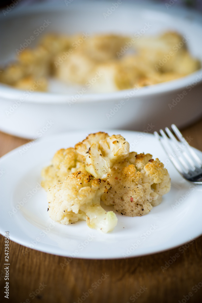 baked cauliflower with spices in ceramic form baked cauliflower with spices in ceramic form