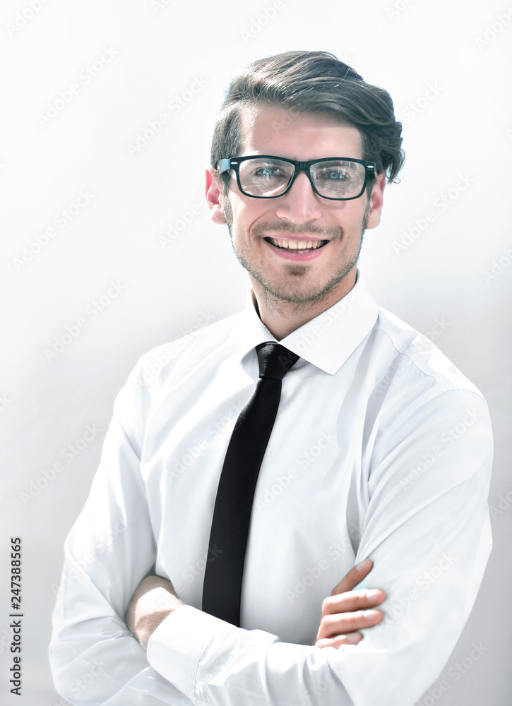 successful young businessman on a bright background successful young businessman on a bright background