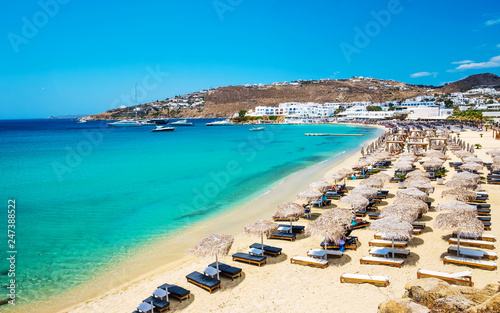 Fototapeta Naklejka Na Ścianę i Meble -  Beautiful beach of Mykonos with deck chairs and umbrellas, Greece