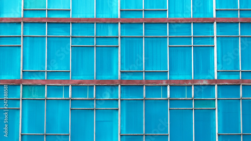 glass background. blue background, asymmetry. glare on the glass. pool facade
