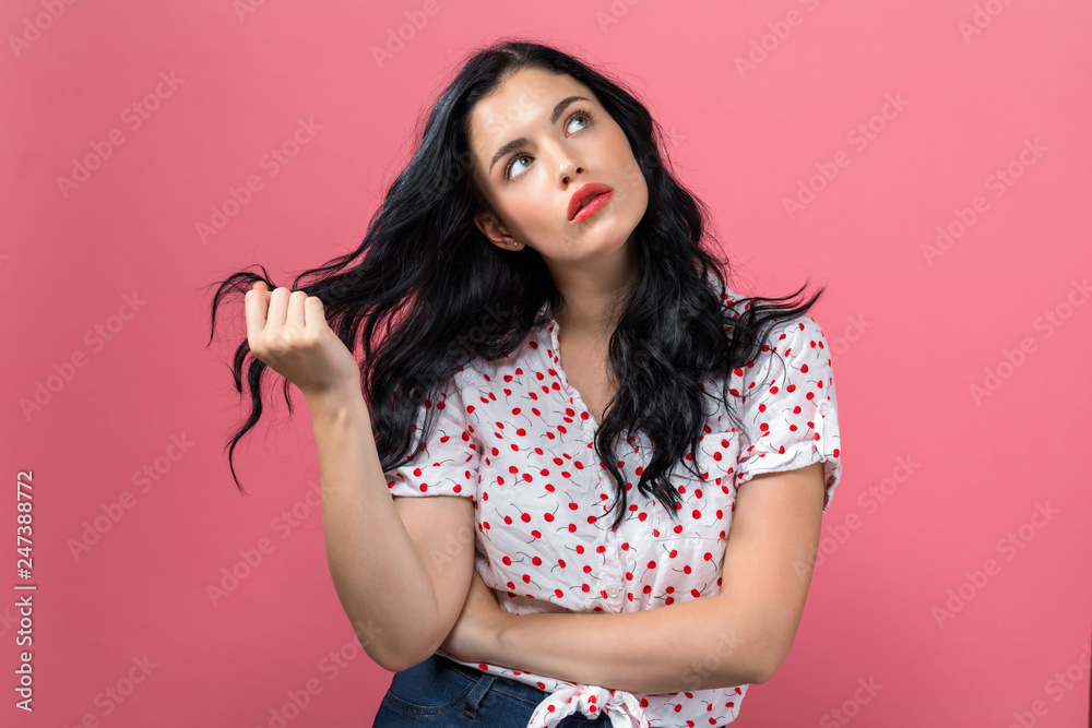 Fototapeta premium Bored young woman on a solid background
