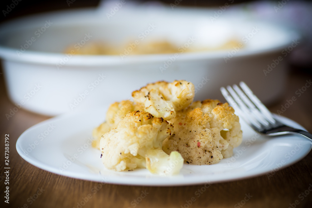 baked cauliflower with spices in ceramic form baked cauliflower with spices in ceramic form