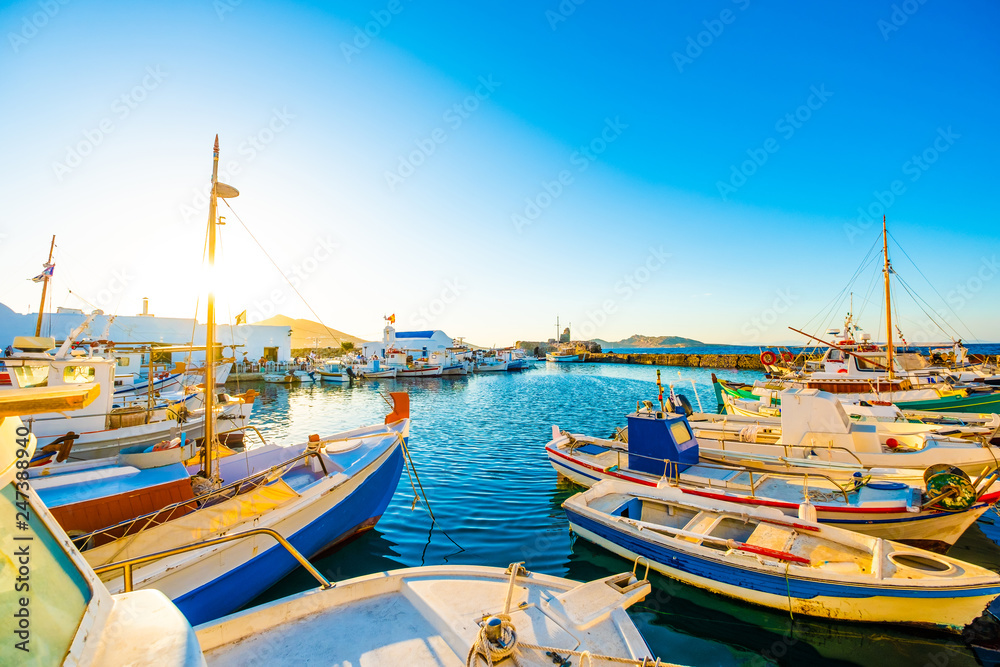 Sunshine view of turquoise bay and colorful yachts at stony berth of greek island Paros Sunshine view of turquoise bay and colorful yachts at stony berth of greek island Paros