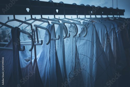 Drying clothes on clothesline on condo in nignt housework and cleaning concepts