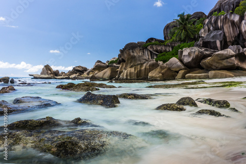 Beautiful waves on a  remote beach on a tropical island of Seychelles © travel.n.think