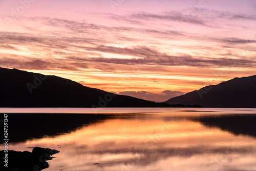 Fototapeta Naklejka Na Ścianę i Meble -  The sun setting over Loch Sunart, Ardnamurchan, on New Years Day night. Scotland. 