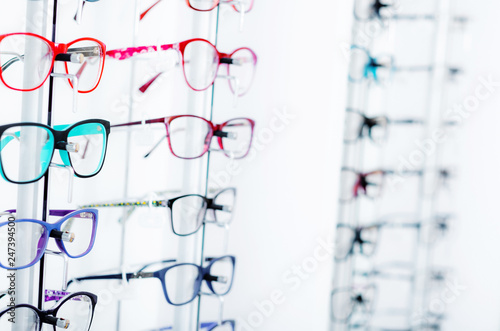 Closeup view of different colorful glasses for kinds on the showcase in the optical store © Ievgen Skrypko