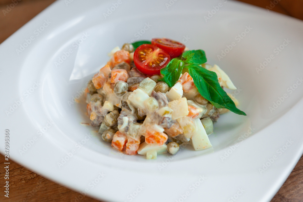 European international fusion cuisine, a beautiful dish on a white plate decorated with herbs and vegetables. a professional chef has prepared a delicious meal. European international fusion cuisine, a beautiful dish on a white plate decorated with herbs and vegetables. a professional chef has prepared a delicious meal.