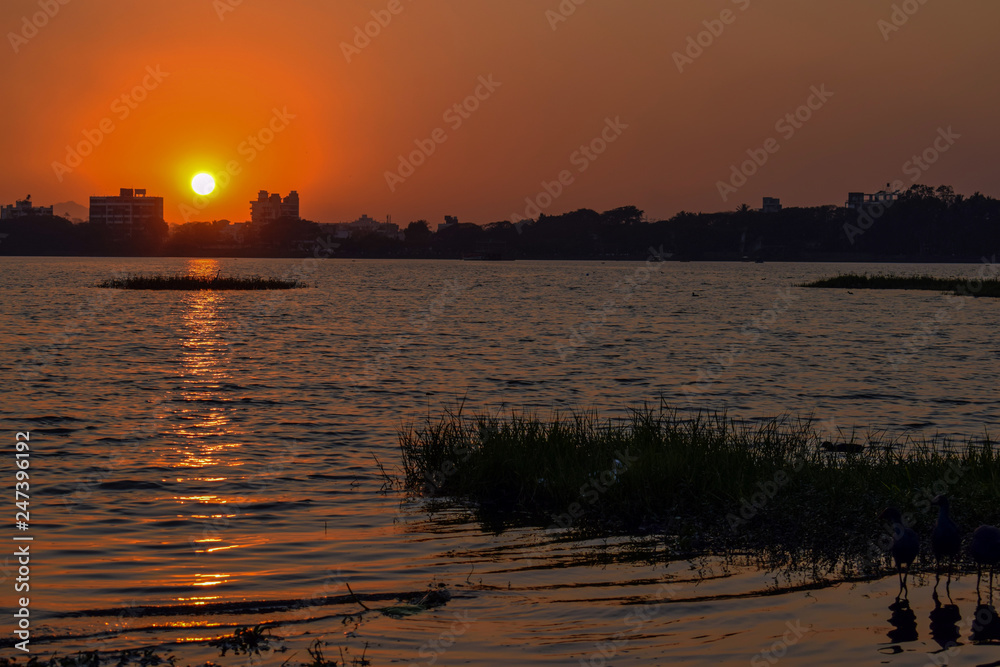 Sunset capture on the beach of a river situated in the old city of India
