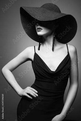 portrait of young lady with black hat and evening dress © Egor Mayer
