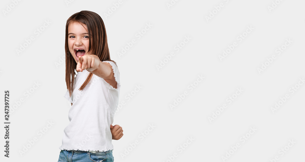 Full body little girl shouting, laughing and making fun of another, concept of mockery and uncontrol Full body little girl shouting, laughing and making fun of another, concept of mockery and uncontrol