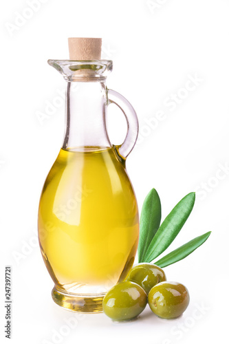 Branch with olives and bottle of virgin olive oil
