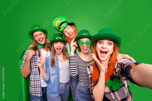 Self-portrait of nice crazy childish attractive cheerful positive stylish people guys ladies wearing costumes showing tongue out v-sign great news isolated over bright vivid shine background