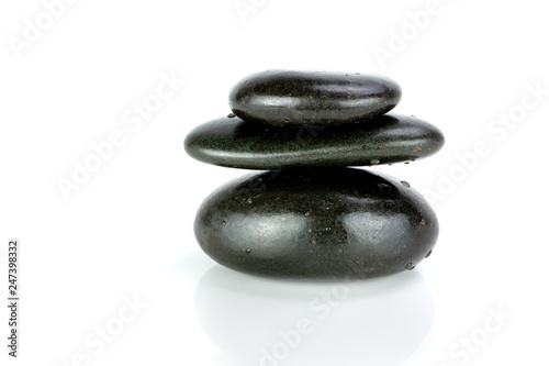 Stack of black pebbles on white background