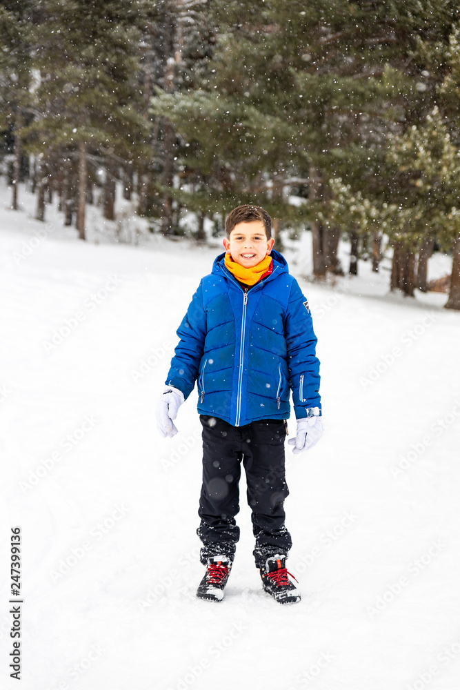 Cute boy in the middle of a snowy field Cute boy in the middle of a snowy field