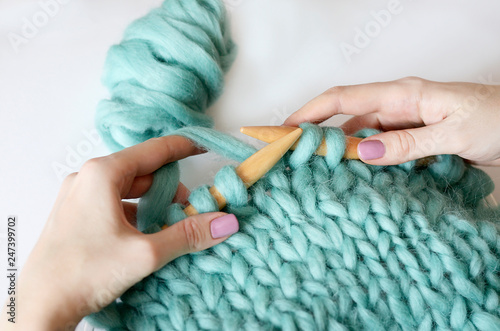 knitting wool yarn turquoise on a light background