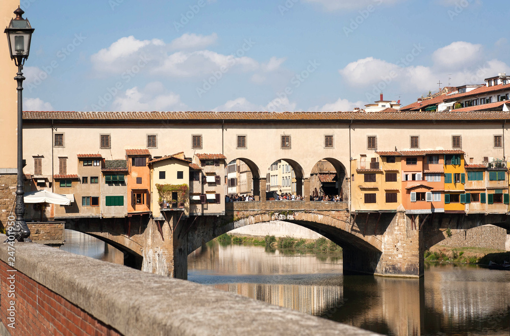 Bridge over river Arno of ancient Tuscany city, Italy. Historical Florence is a UNESCO World Heritage Site