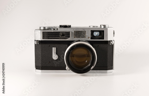 An old film camera is isolated on a white background