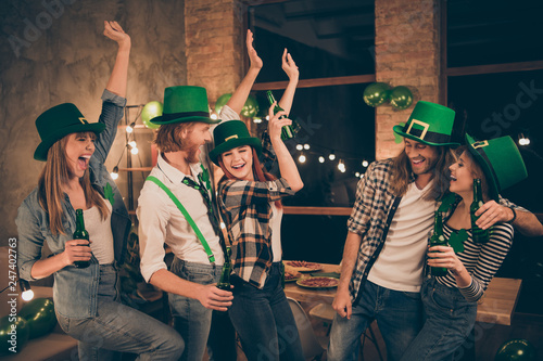 Couples friends pairs lovers relationship one company gathering hug embrace dancing moves having best  time rejoice leisure drinking beer in tradition style leprechaun costumes suits 