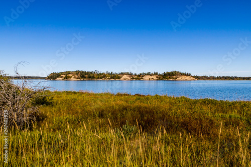 Fototapeta Naklejka Na Ścianę i Meble -  Blue water and blue skies above Glennifer Lakes Provincial Recreation Area, Alberta, Canada