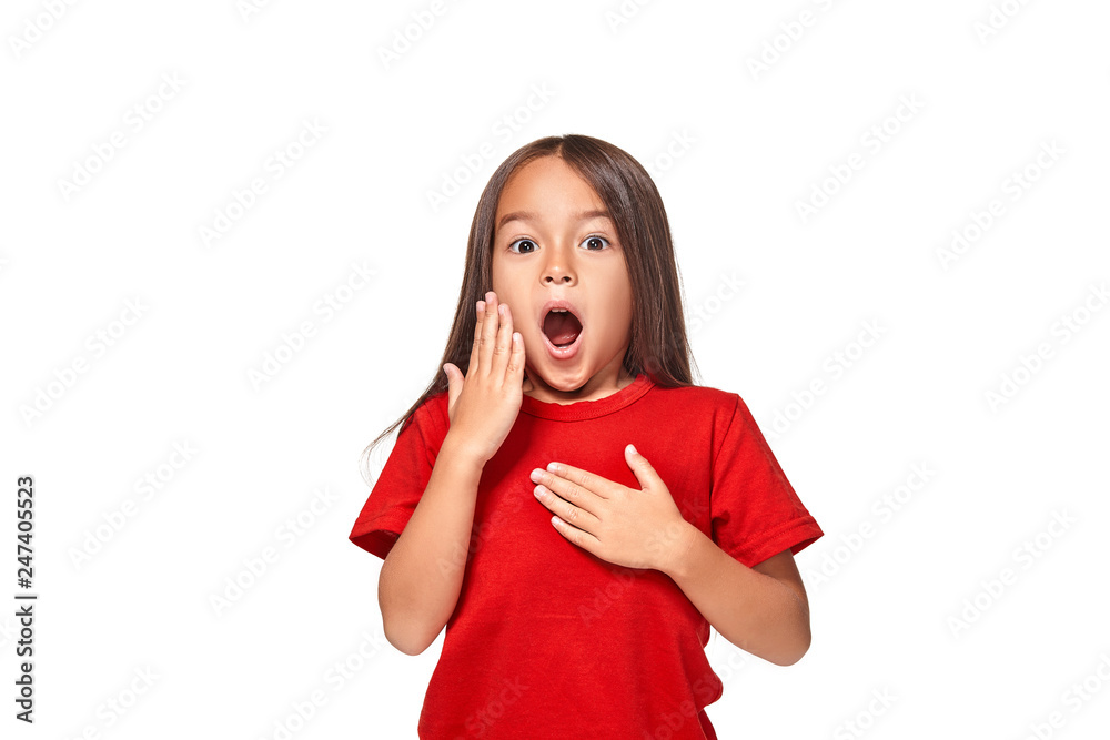 Fototapeta premium Portrait of little surprised girl excited scared. Isolated on white background