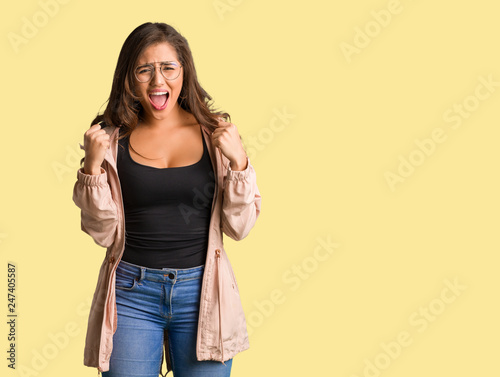 Full body young curvy woman screaming very angry and aggressive