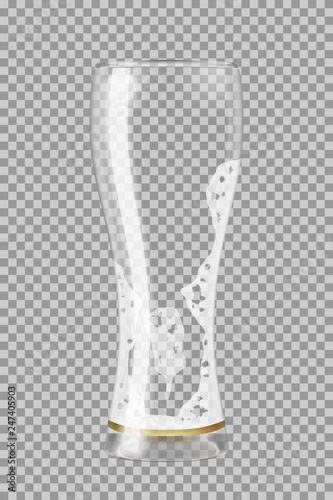 Tall beer glass with lager beer almost empty