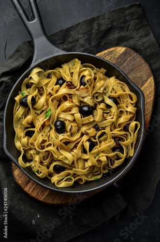 Tasty pasta with black olives
