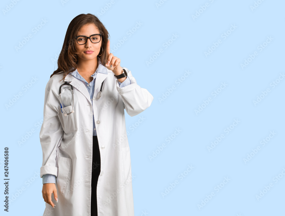 Full body young doctor woman showing number one Full body young doctor woman showing number one