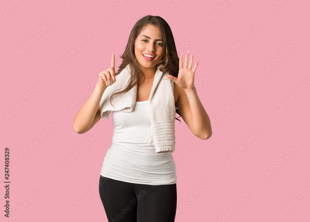 Full body young fitness curvy woman showing number six Full body young fitness curvy woman showing number six