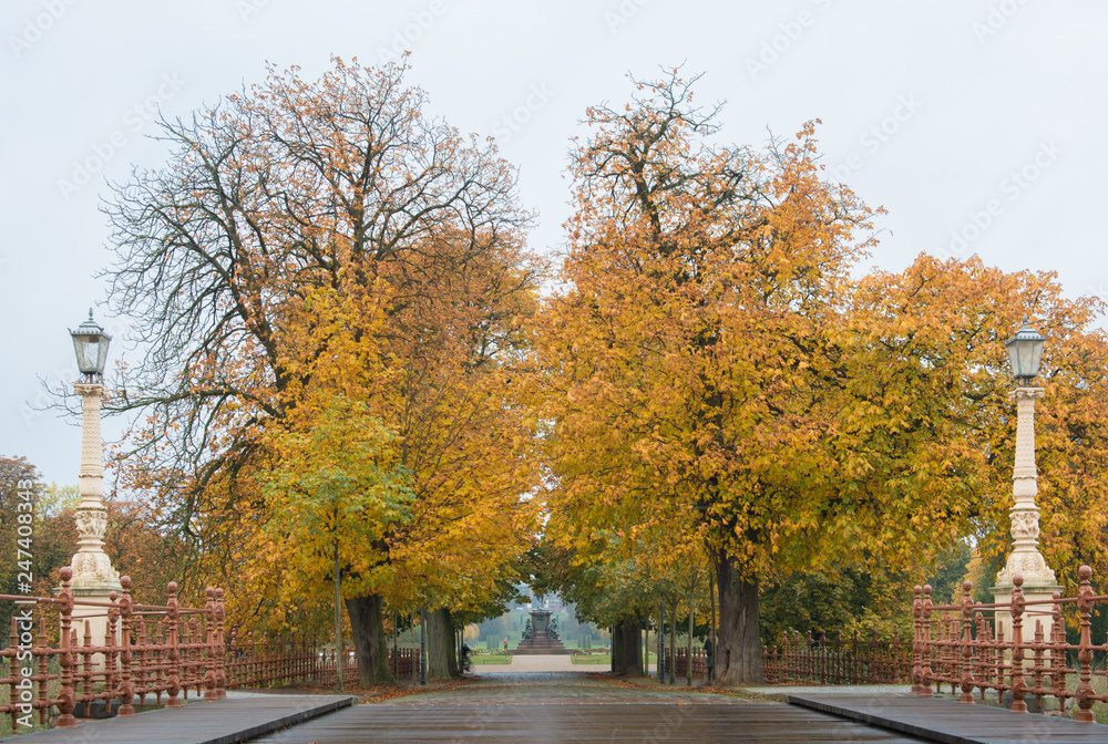 Bridge with autumn trees, Schwerin, Germany Bridge with autumn trees, Schwerin, Germany