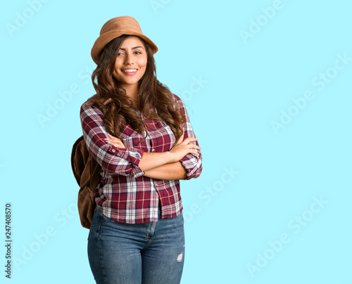 Full body young traveler curvy woman crossing arms, smiling and relaxed