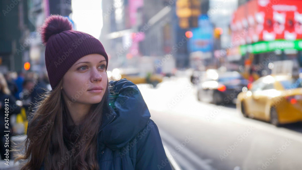 Young beautiful woman in the streets of New York for sightseeing