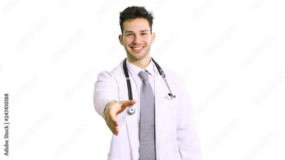 Portrait of a smiling handsome doctor giving a handshake isolated on white Portrait of a smiling handsome doctor giving a handshake isolated on white