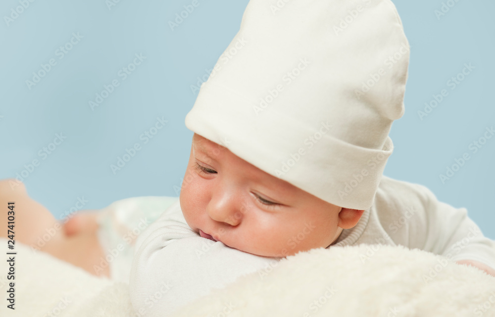 emotional newborn beautiful tender baby lies on a white blanket. The concept of health emotional newborn beautiful tender baby lies on a white blanket. The concept of health