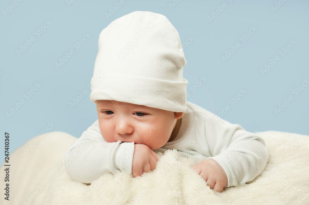 emotional newborn beautiful tender baby lies on a white blanket. The concept of health emotional newborn beautiful tender baby lies on a white blanket. The concept of health