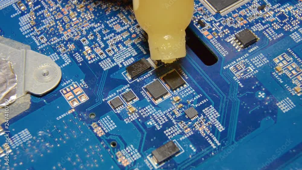 chip soldering. chip soldering. replacement of a faulty chip. Male hand