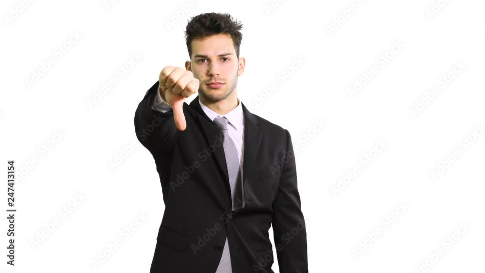 Disappointed young business man showing thumb down sign, isolated on white Disappointed young business man showing thumb down sign, isolated on white