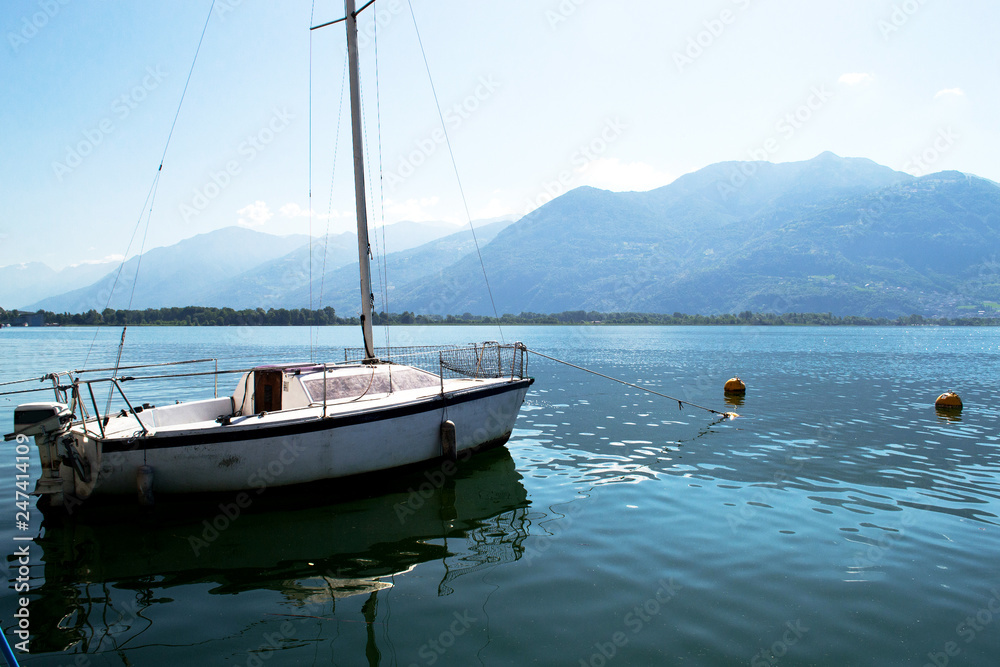 Beautiful view of the coast of Italy. Beautiful view from the boats at the shore. Lake with boats along the coast of Italy.