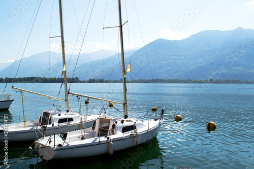 Beautiful view of the coast of Italy. Beautiful view from the boats at the shore. Lake with boats along the coast of Italy. © liubovi samoilova