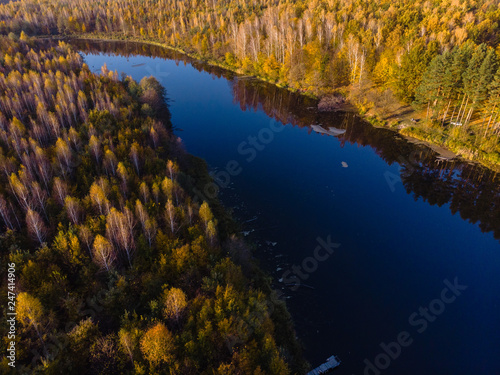 beautiful view from the drone to the lake in the forest, autumn day, multicolor trees, bright. outdoor recreation concept, in the countryside, barbecue fishing and camping