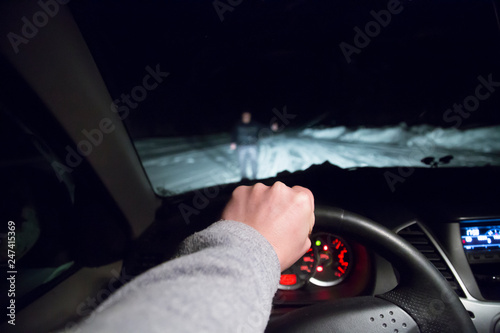 man drives a car at night © Александр Поташев