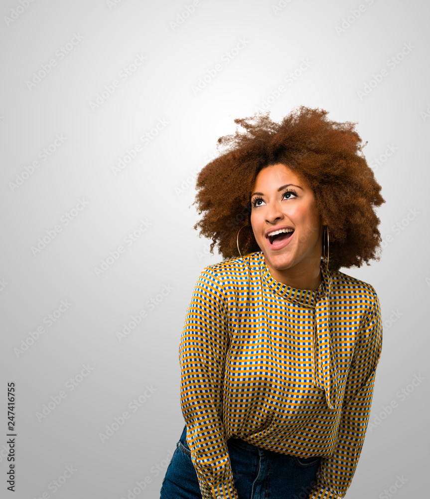 Afro woman looking up Afro woman looking up