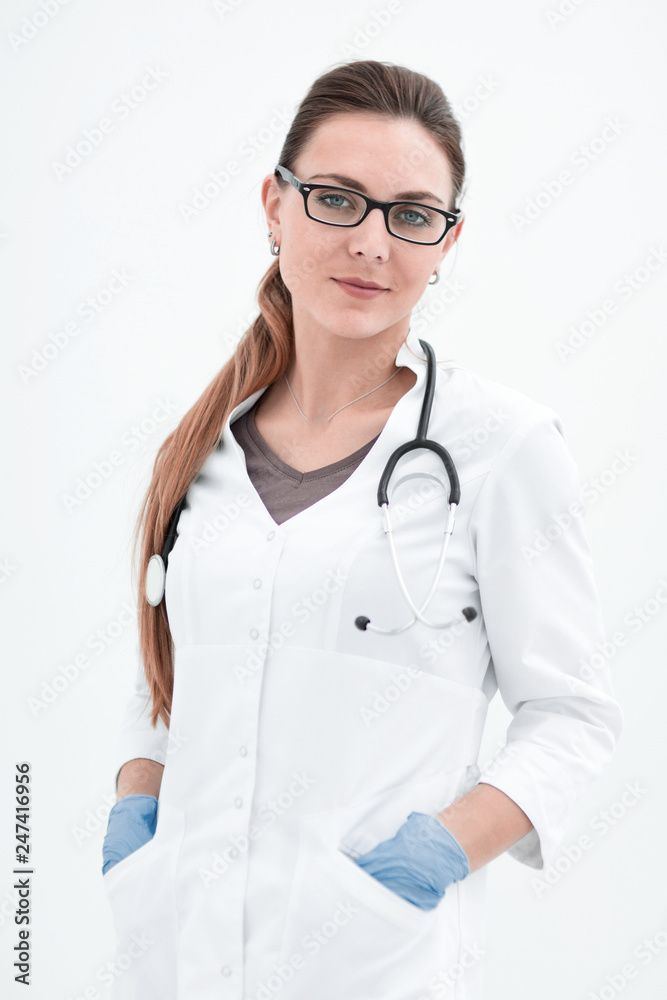 portrait of a serious woman doctor on a light background. portrait of a serious woman doctor on a light background.